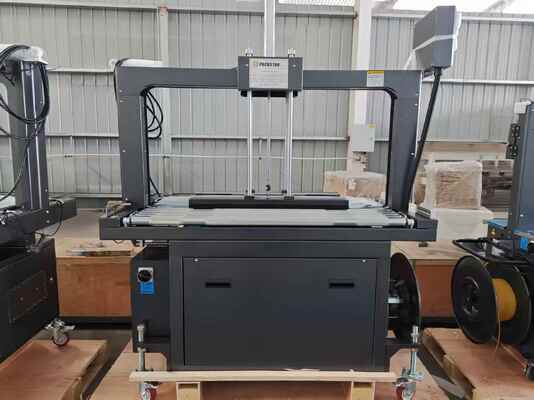 Jakość  Semi-Automatic 1200mm Carton Box Strapping Machine with One Year Warranty for Efficient Packing fabryka